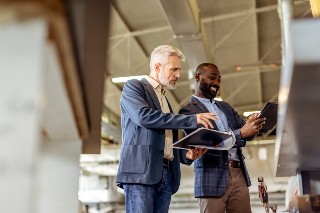 Employees discussing knowledge management tactics