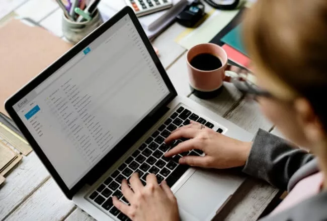 businesswoman checking email for internal newsletter