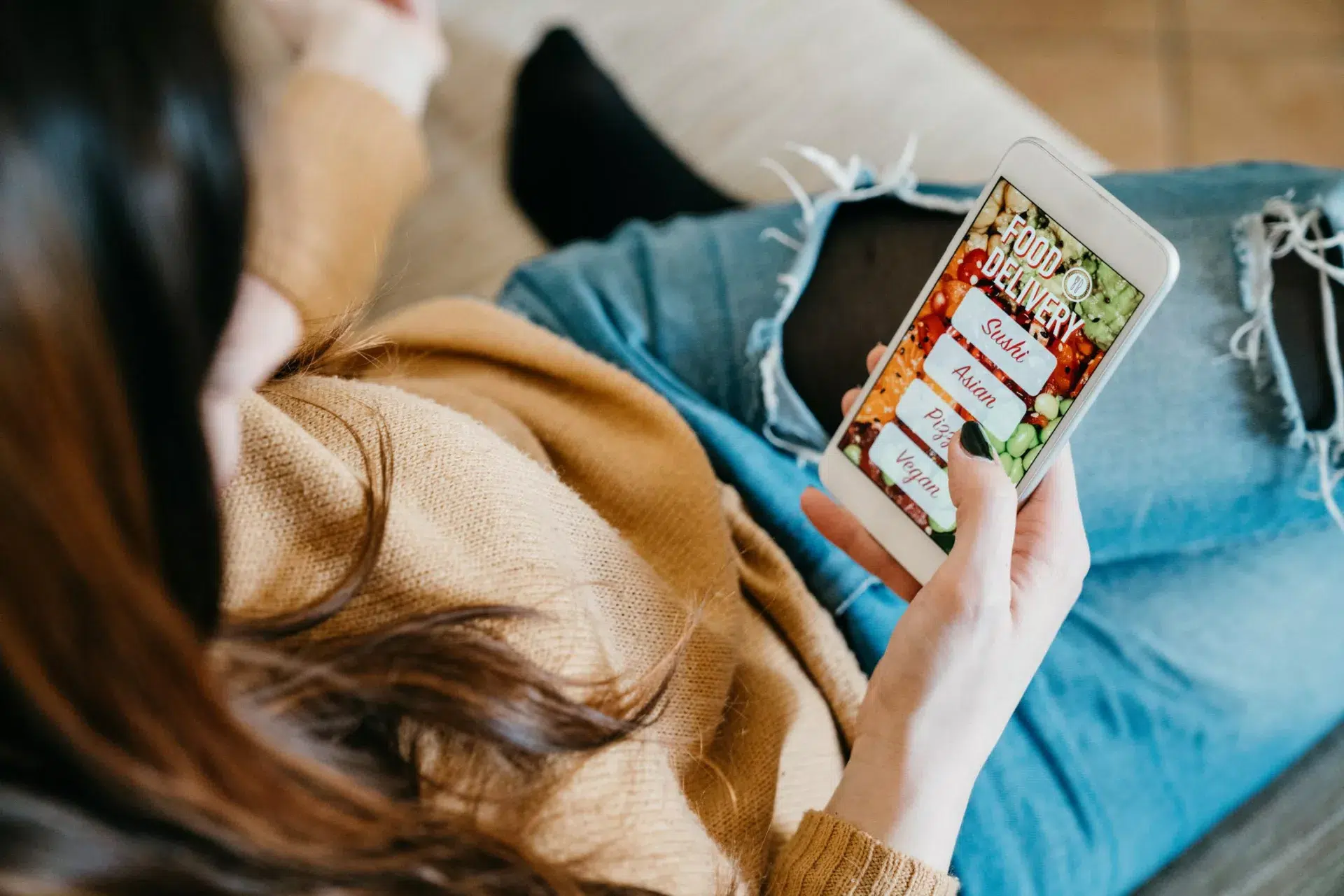 woman ordering food through mobile app representative of new consumer behaviors