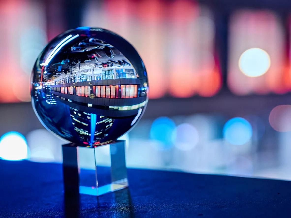 crystal ball with city backdrop represents market research trends