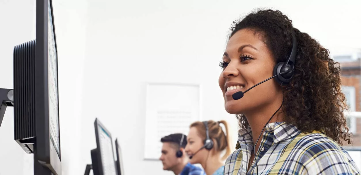 woman with headset demonstrating good customer service skills