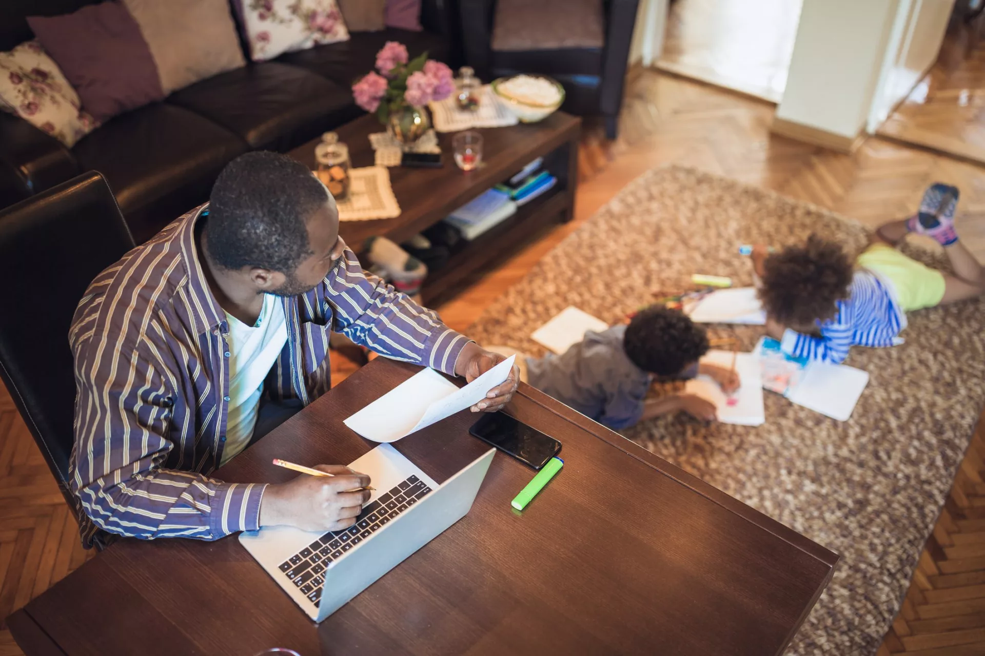 father at home with kids in flexible work environment