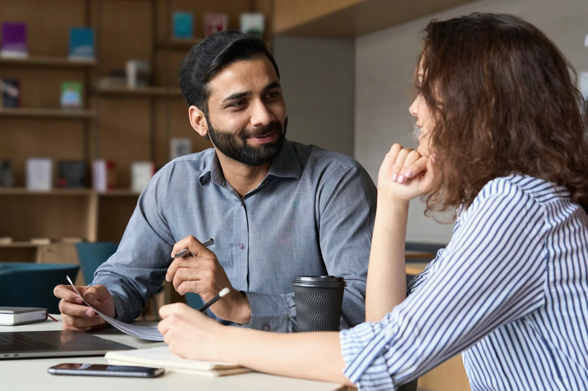 manager meeting one on one with team member to demonstrate people management