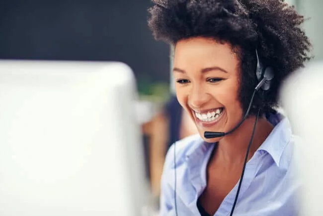 young call center rep smiling after completing customer service training