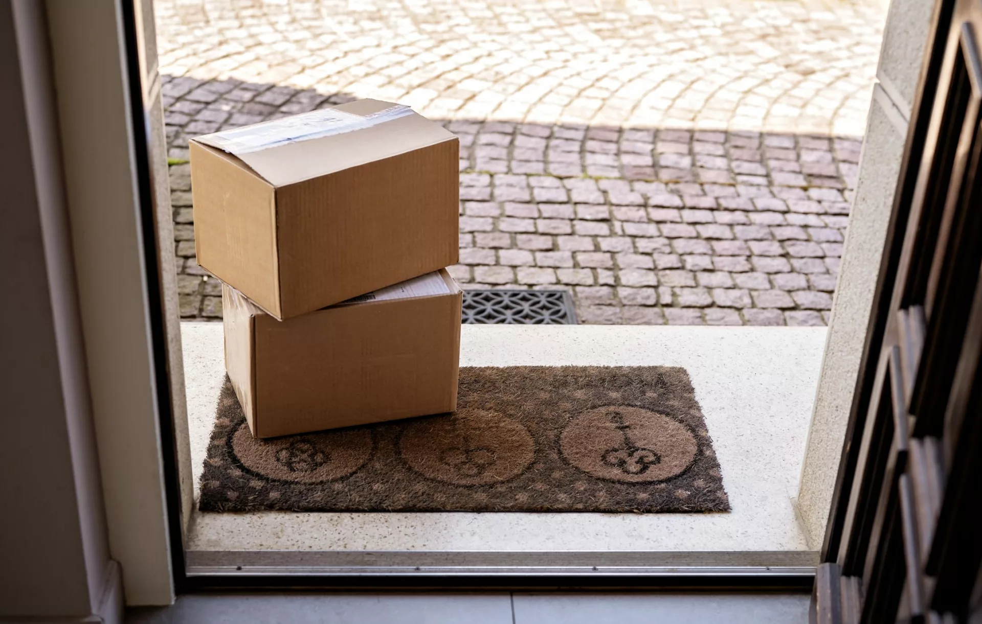 packages in front of door representing knowledge delivery