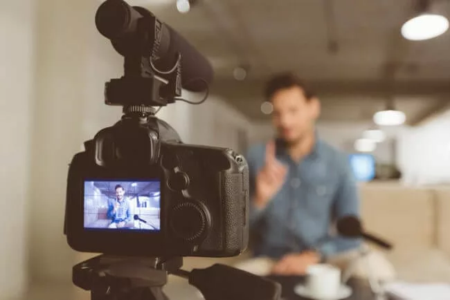 man recording knowledge base videos in office