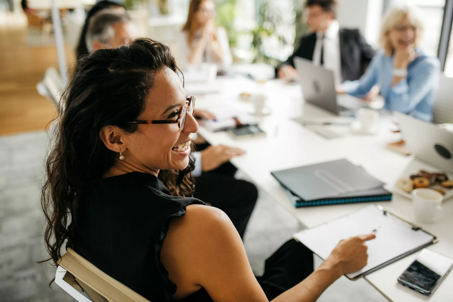 smiling insights team leader in company with great EX