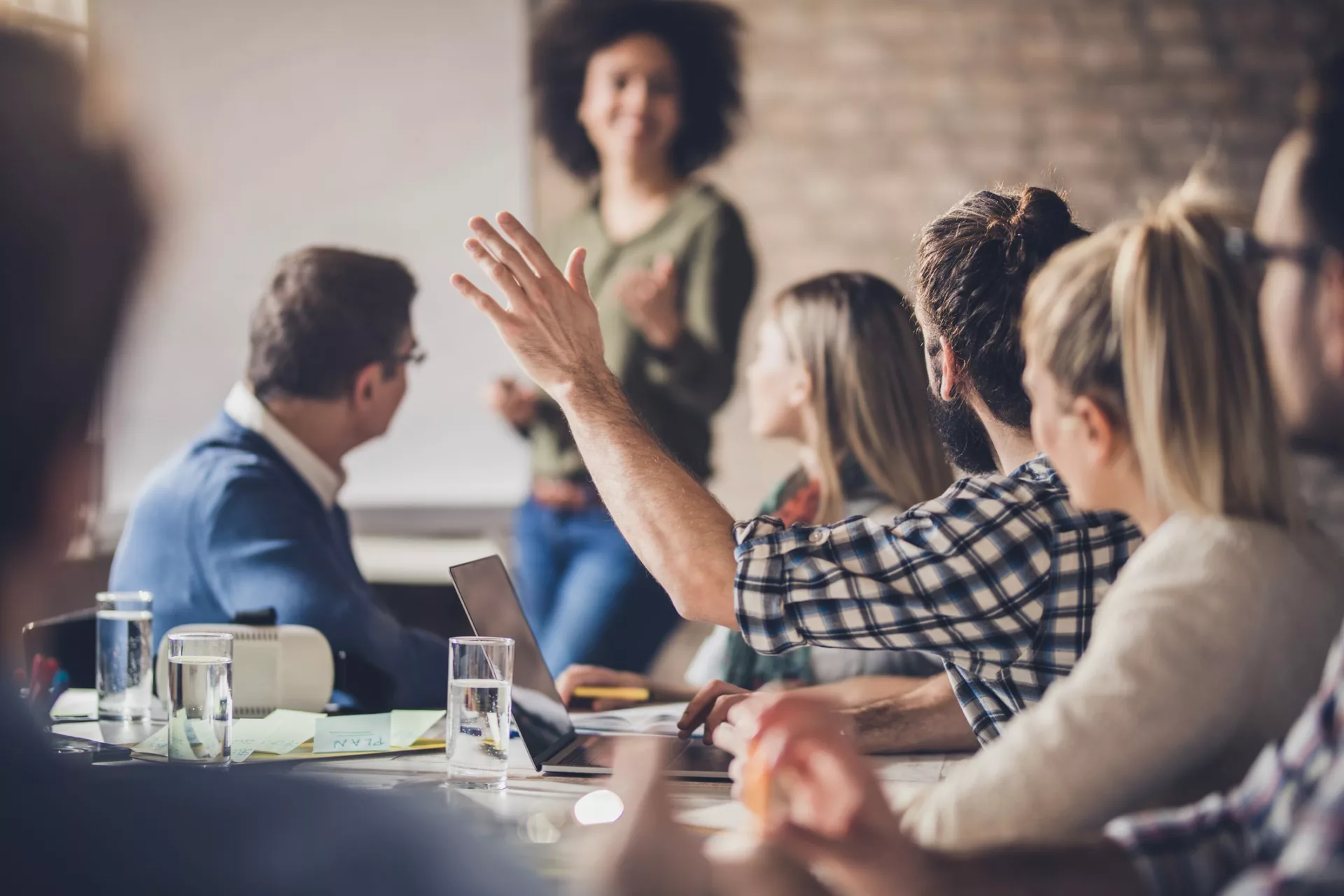 team member asking question during meeting demonstrates the importance of change management