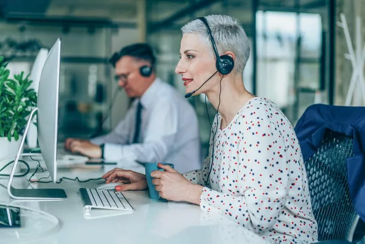 two call center employees use knowledge sharing tech as part of customer service strategy