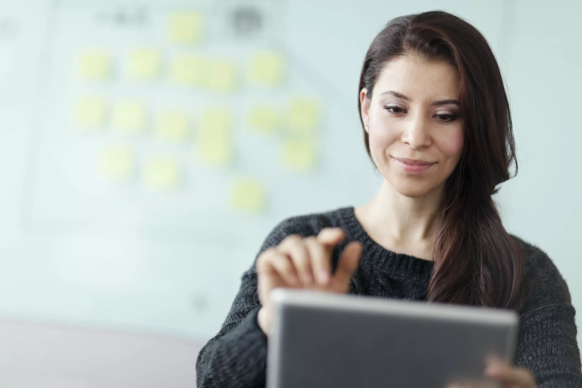 woman accessing secondary market research on tablet