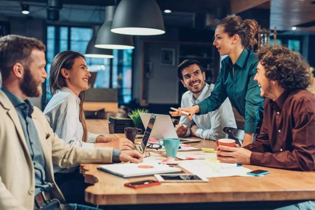 woman with a career in knowledge management presents at informal meeting