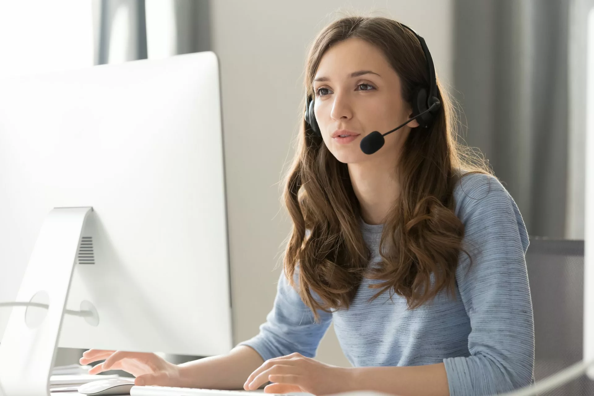 woman on headset using products across Microsoft ecosystem|
