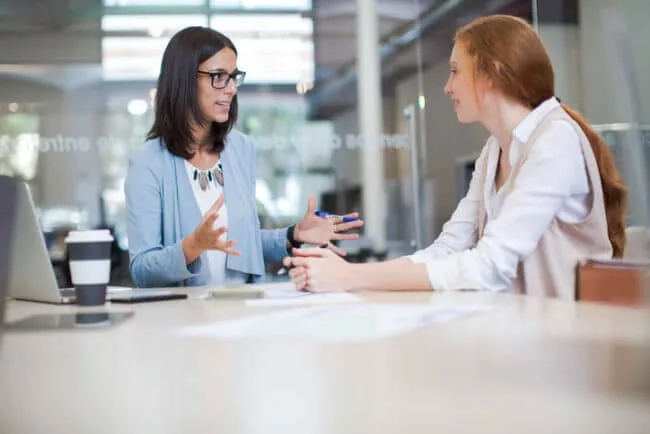 subject matter expert meets with new hire to provide training content