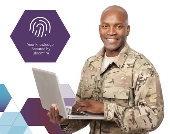 Man in army fatigues with laptop