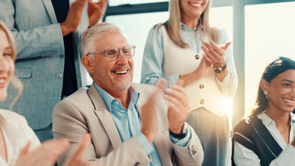 Employees celebrating their other employee staying with the company