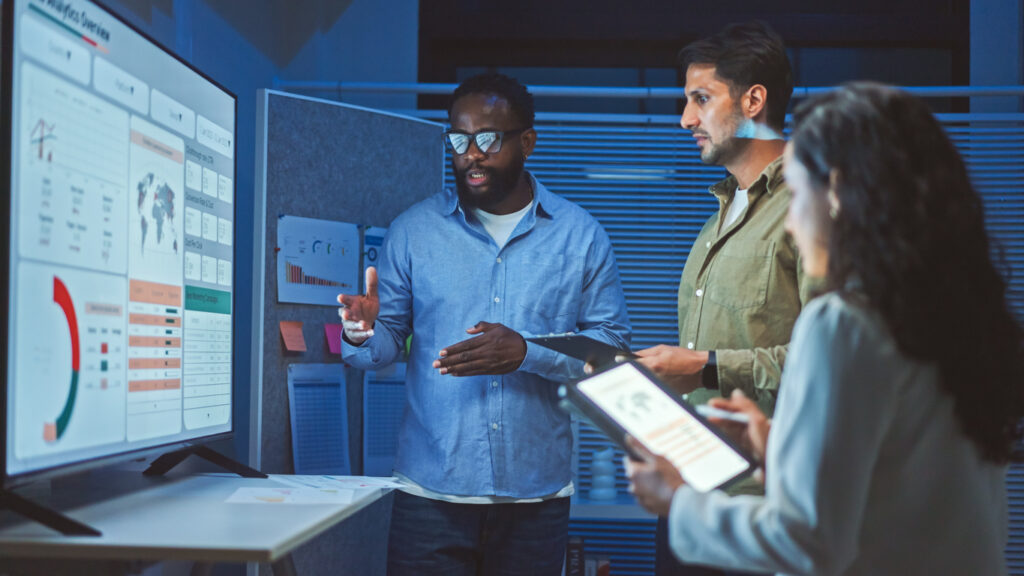 Employees Examining Data