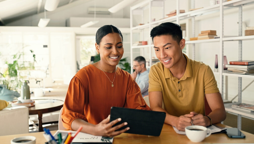 Two knowledge management leaders discussing customer insights