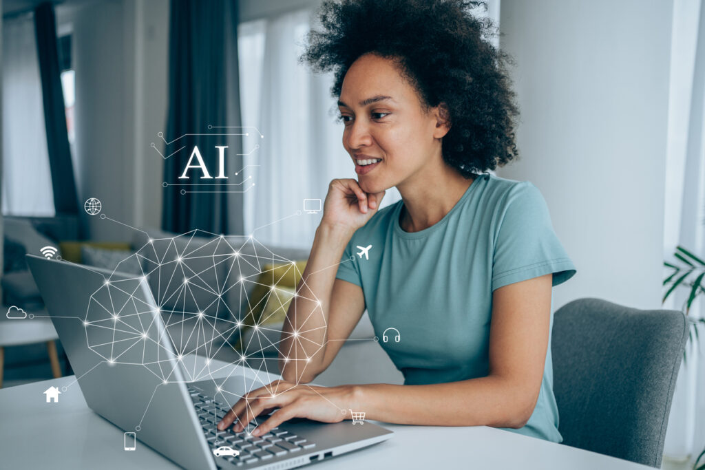 A woman in front of a computer accessing AI-powered customer insights