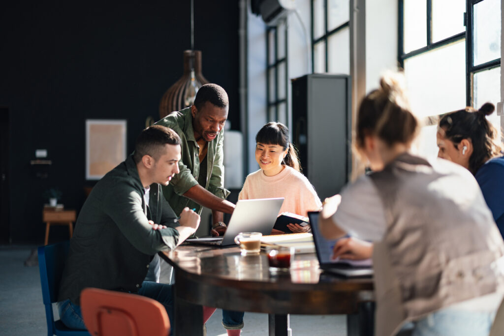 A group of employees working together to improve collaboration in their organization