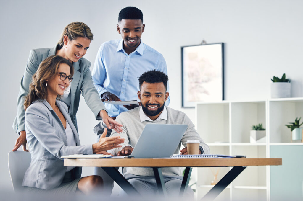 A team of employees looking into the most relevant enterprise AI search features for their organization