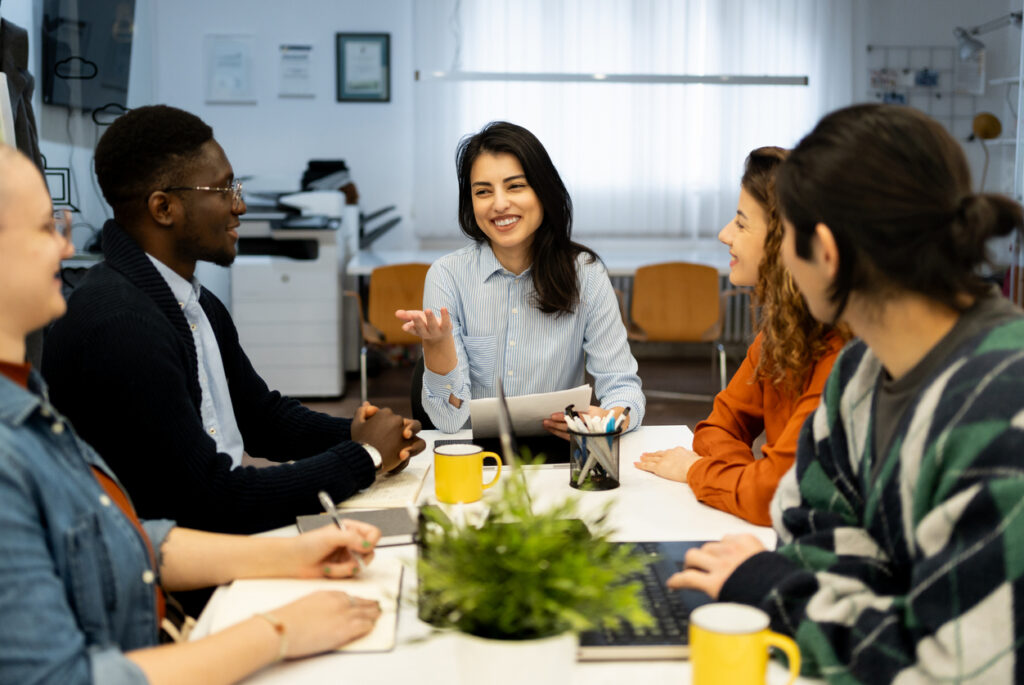 A team of employees having one of their knowledge sharing sessions