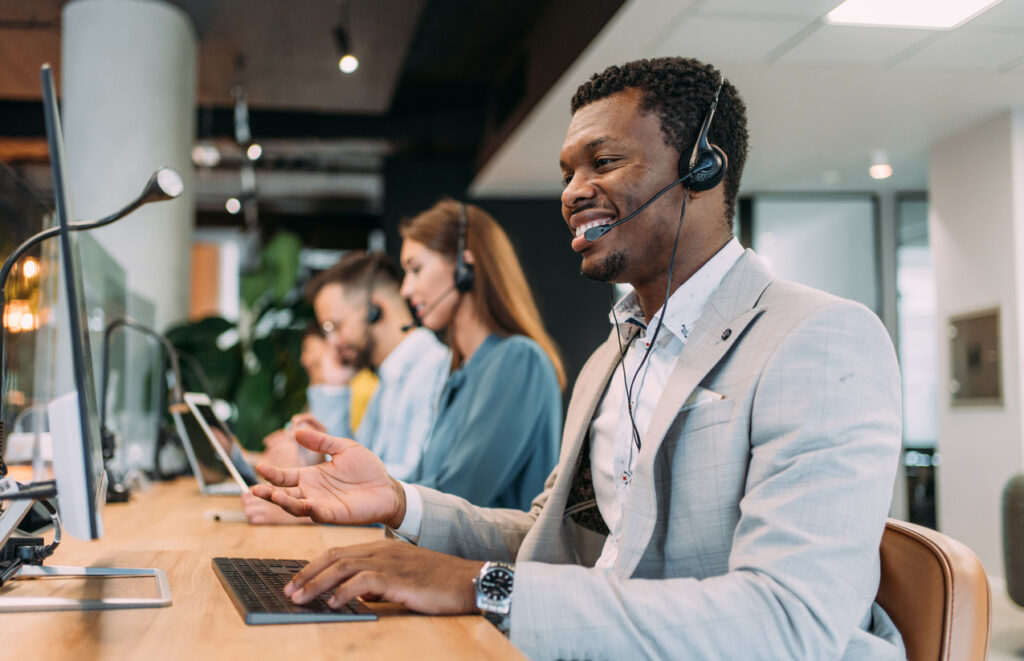 Shot of call center operators working in the office.