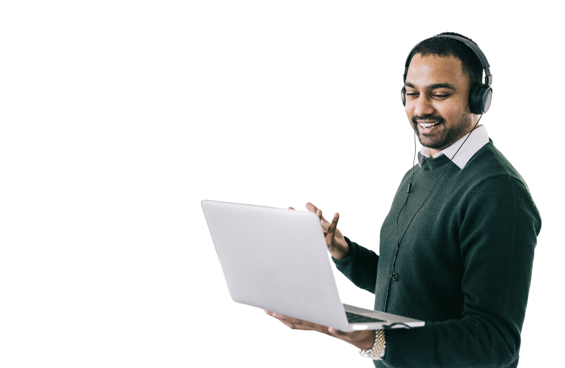 Male holding laptop wearing a headset