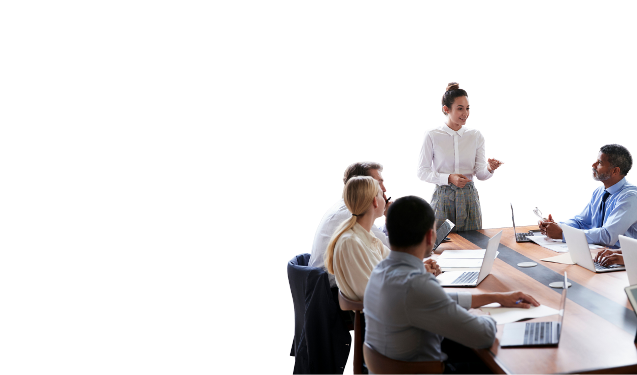 A group of Executive Leadership gathered around meeting table