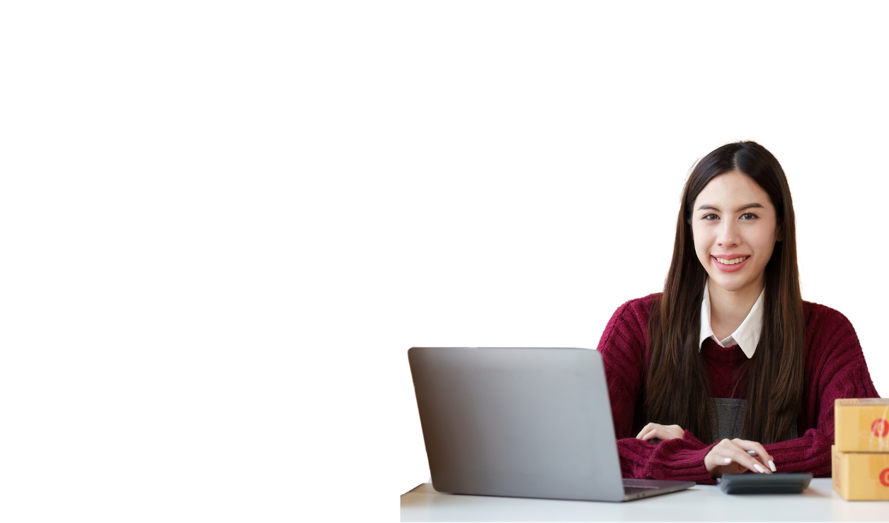 Professional woman sitting at her laptop smiling