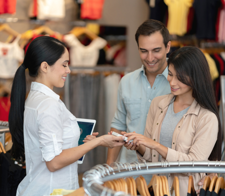 Retail operations employee assisting customers