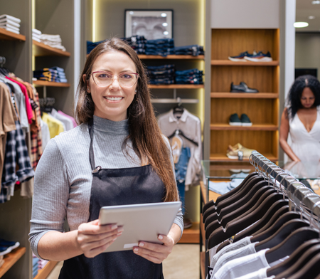 Retail operations employee smiling in store