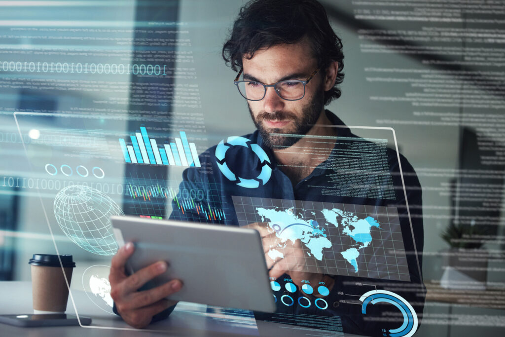 A man looking at analytics, defining what is business intelligence