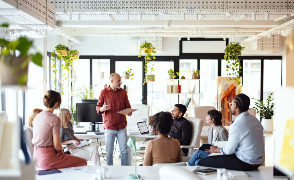 A team of knowledge leaders discussing the strategies for preserving knowledge in their organization