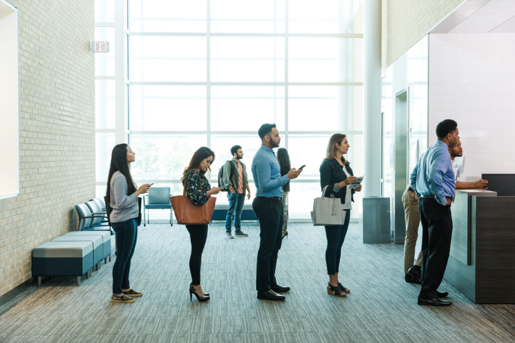 Employees waiting too long in line, symbolizing need for knowledge management